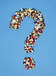 A question mark made of pills